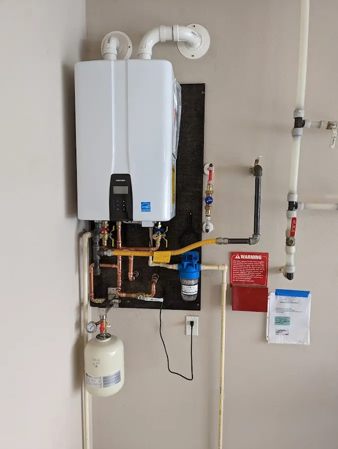 Professional plumber installing copper piping in a Flemingsburg home